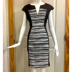 Black knit dress with striped front panel